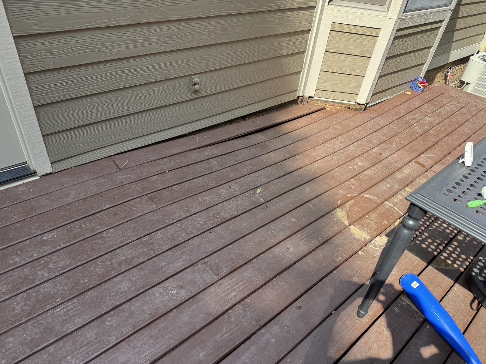 Weathered composite deck boards before the rebuild