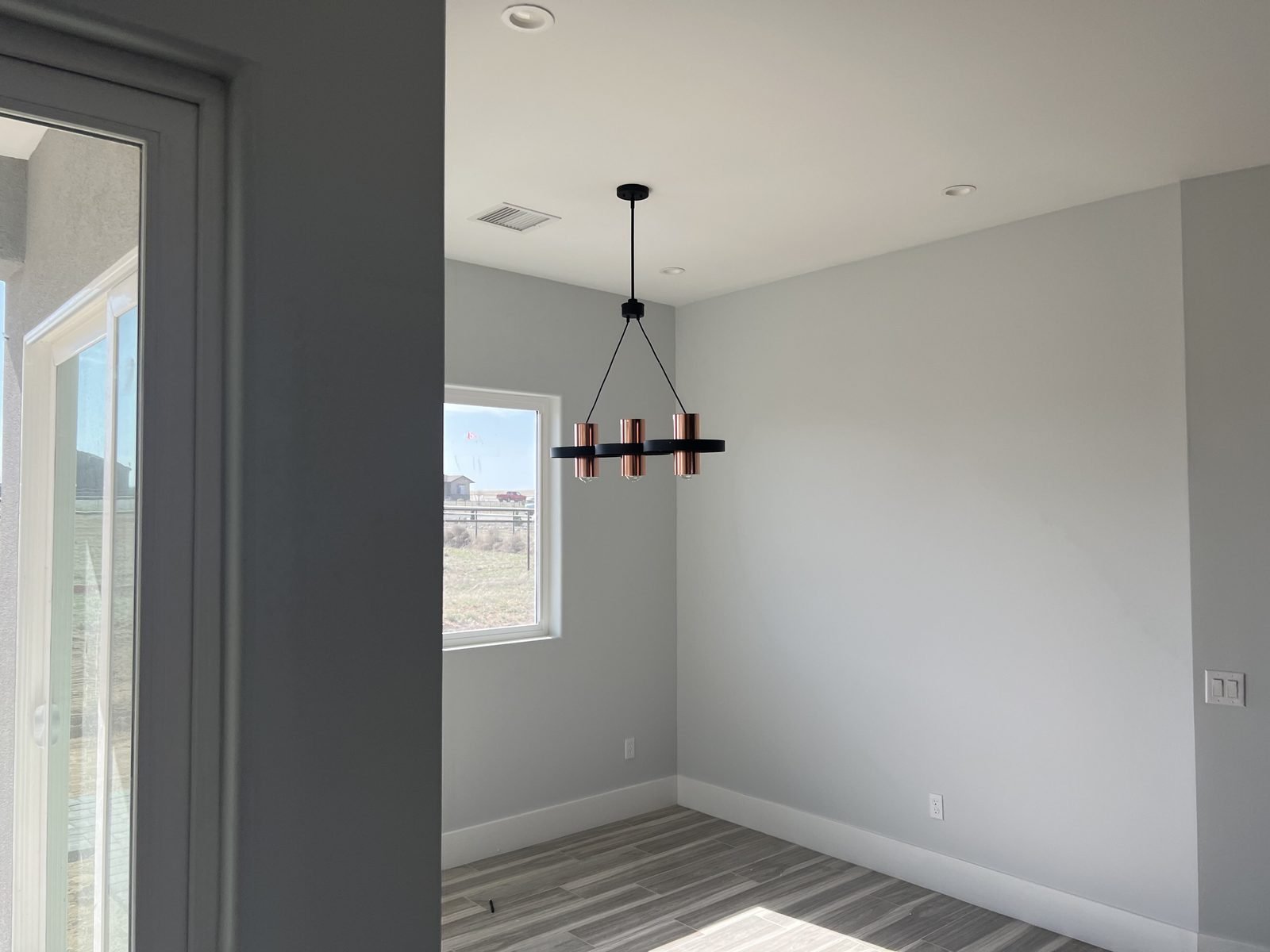 Dining room with a new modern black chandelier