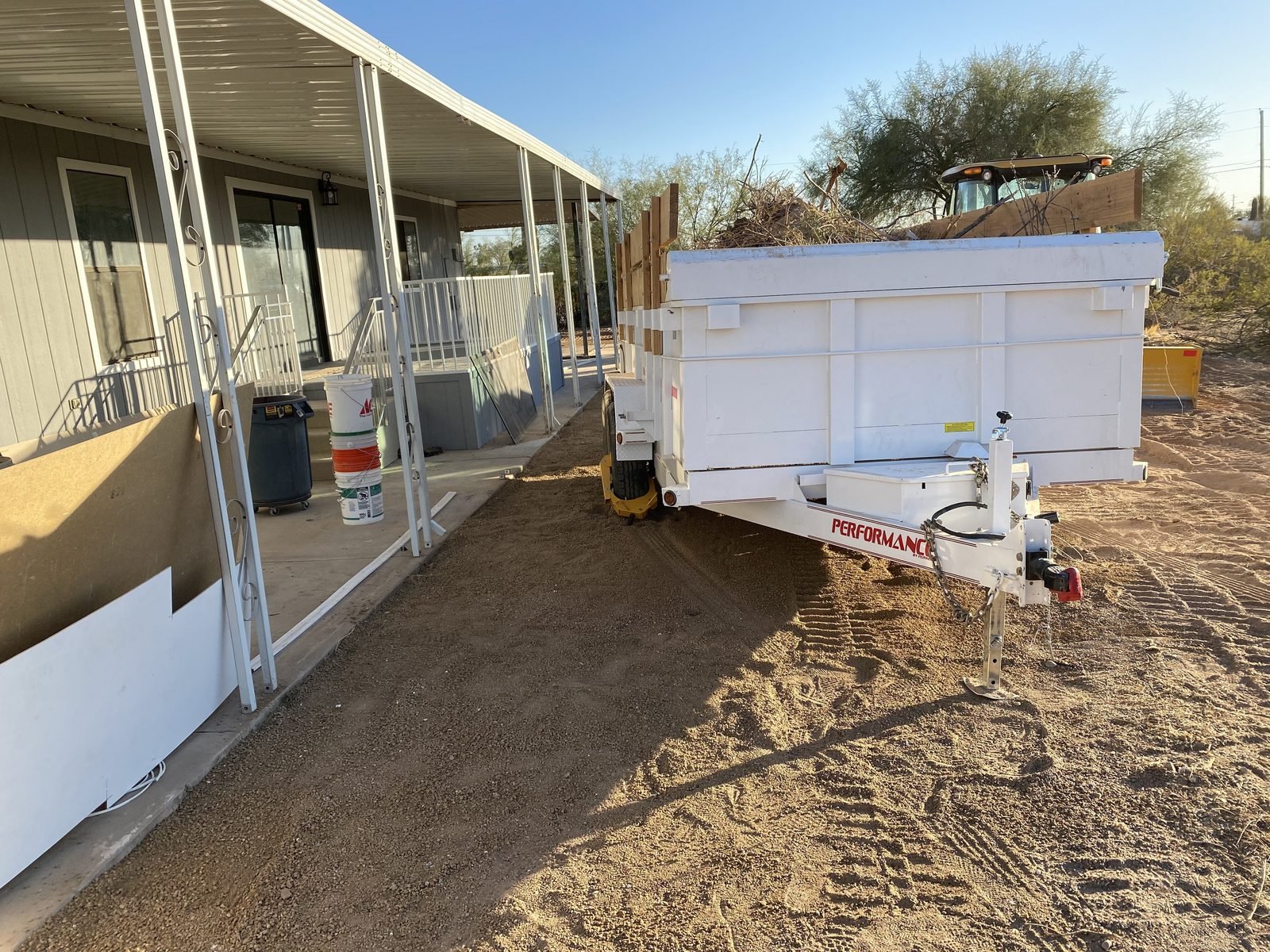 Dump trailer loaded with demolition debris on a jobsite