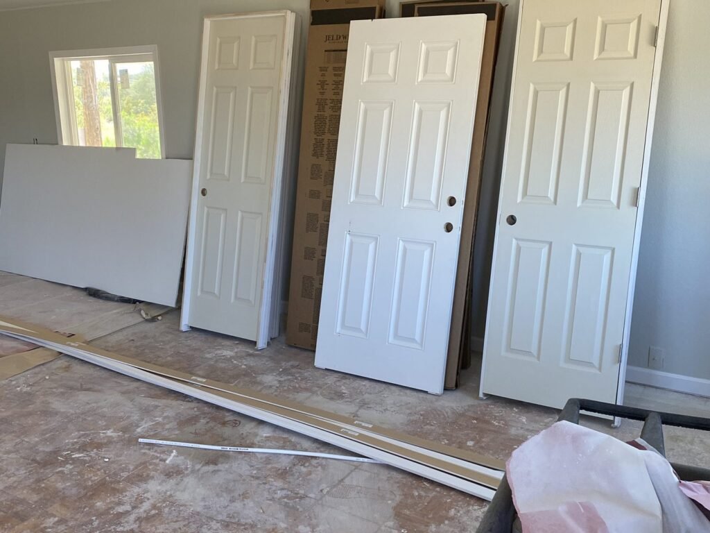 New six-panel interior doors ready to be hung