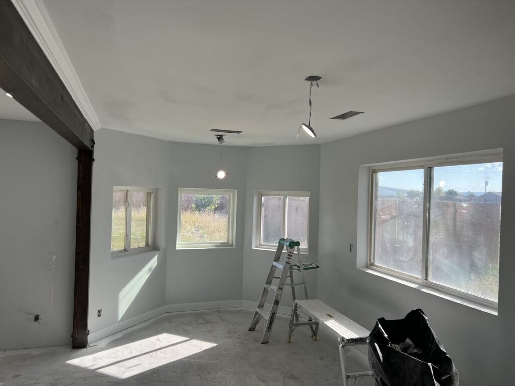 Empty room part-way through interior painting