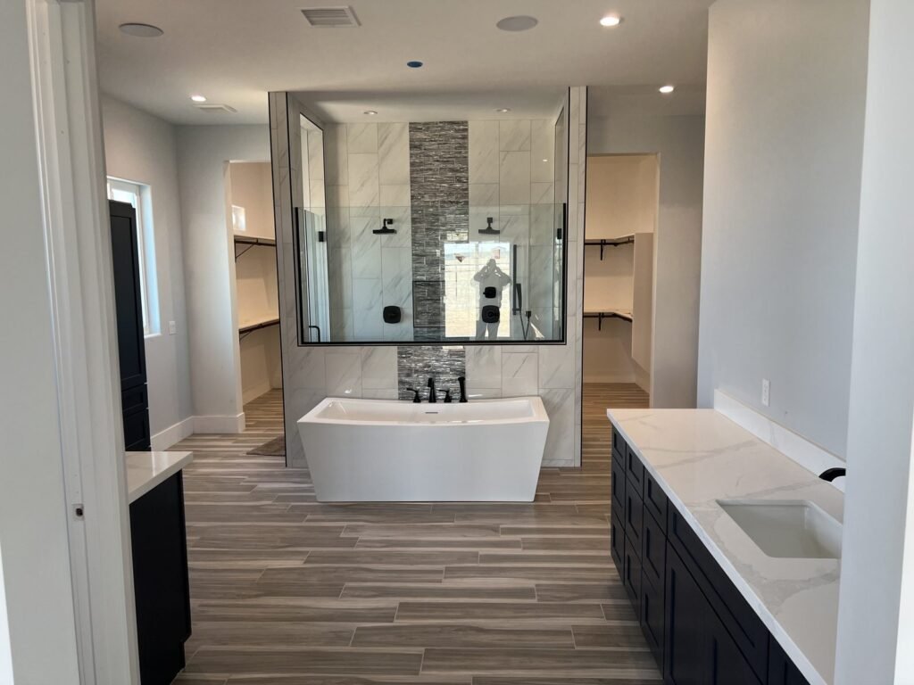 Master bathroom with freestanding tub and glass-enclosed shower