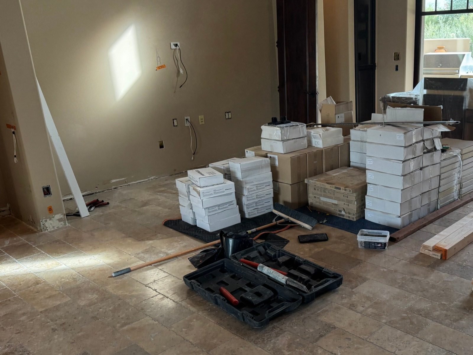 Bare wall stacked with tile and materials before the built-in TV wall was built