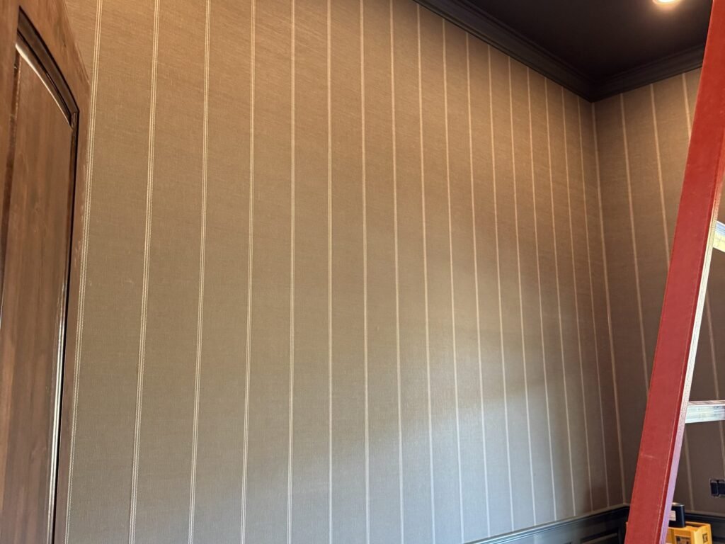 Interior wall clad in vertical wood paneling